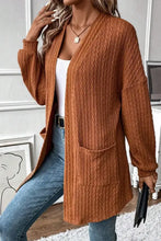 Burnt orange long sleeve pocketed open cardigan with v-neck and textured fabric