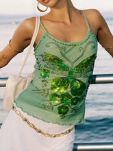 A shimmering mint green butterfly embellished slim fit cami with sequins and floral embellishments