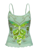 A mint green butterfly embellished slim fit cami with sequins gold embroidery and floral accents