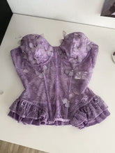 A delicate lavender butterfly lace tube top with sheer butterfly appliqués and a ruffled hem in lace tube style