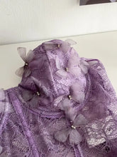 A delicate lavender butterfly lace tube top featuring sheer translucent butterfly embellishments in lace tube design