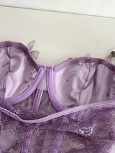Delicate lavender butterfly lace tube top with satin-lined interior and adjustable straps made of lace fabric