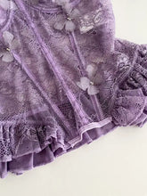 A delicate lavender butterfly lace tube top featuring sheer butterfly embellishments and a ruffled hem