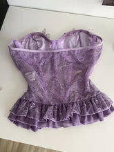 Lavender butterfly lace tube top with lace corset design, ruffled hem, and satin lining for elegant wear
