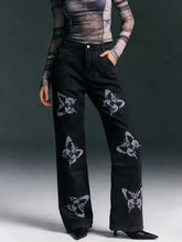 Black high-waisted wide-leg jeans with a bold white and gray butterfly print for stylish butterfly print jeans