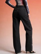 Black wide-leg denim butterfly print jeans with high waist straight cut and subtle white embroidery on lower leg