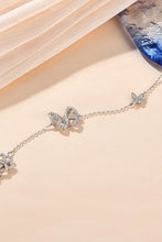 Silver-toned chain bracelet with pavé moissanite butterfly charms