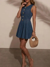 Blue denim sleeveless dress featuring gold-toned buttons down the front showcasing a stylish sleeveless denim design
