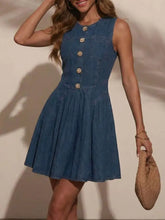 Sleeveless denim dress with a fitted bodice, flared skirt, and decorative gold-toned buttons down the front