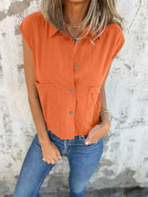 Orange sleeveless button-down cap sleeve shirt with collar and front pockets perfect for casual wear