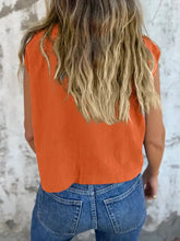 Orange cap sleeve button-down shirt with relaxed fit and slightly cropped hemline for casual wear