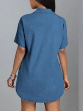 Blue denim dress with collared neck short sleeves and slightly stretchy fabric in a button down style