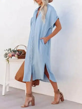 Light blue denim midi shirt dress with button down front long sleeves side slit and front pockets