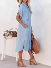 Light blue short-sleeved denim midi shirt dress with collar and side slit perfect as a casual shirt dress