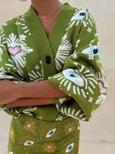 Olijfgroene cardigan met verlaagde schouders en oog-zonnestraalpatroon