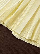 Pale yellow pleated skirt detail on Button-Down Flounce Sleeve Sweater Dress