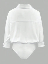 White satin long sleeve bodysuit with rolled cuffs and subtle seam detail in a button-down design