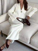 Sleek black clutch with gold hardware in Button Down Knit Set