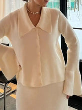 Cream-colored long-sleeved knit cardigan with wide collar and bell cuffs from Button Down set