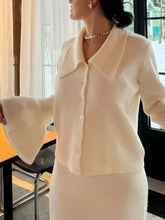 Cream-colored button-down long-sleeve knit cardigan with wide collar