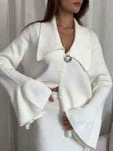 White knit button-down cardigan with flared sleeves and collar