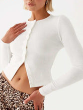 White ribbed long-sleeve crop top with button closure and moderate stretch