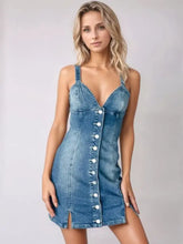 A fitted blue denim dress with a plunging neckline button-front closure and side slit mini cami denim style