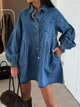 Blue denim mini dress with heart-shaped buttons, elasticated cuffs, and front pockets in a button down style
