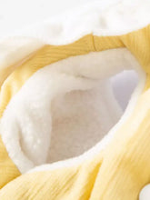 Yellow pet jumpsuit with ruffle collar, white fleece interior, ruffled trim