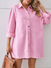 Pink raw hem denim dress with button-front closure and two front pockets in button-down style
