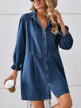 Denim dress in button front design with long sleeves and ruffle cuff detail suitable for machine wash care