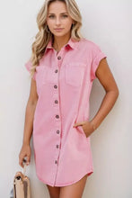 Pink denim dress with short sleeve rolled sleeves and front button closure in soft denim fabric