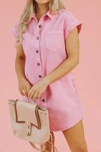 Pink denim dress with button down front short sleeves and a front pocket featuring short sleeve denim style
