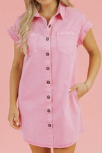 Pink denim dress with short sleeves and front button closure featuring a casual short sleeve denim design