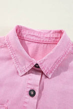 Pink denim short sleeve dress with button down front and dark buttons crafted from durable denim fabric