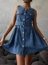 Blue denim sleeveless denim dress with gold-tone buttons and belted waist ideal for casual wear