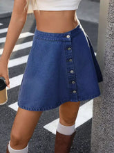 Blue denim skirt with button-front closure and flared hem showcasing a button-front a-line denim skirt design