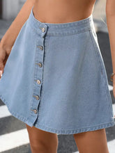 Light blue denim skirt with button-front a-line denim design and subtle stitching details in soft denim fabric