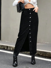 Black denim skirt with front button closure and high slit showcasing stylish denim skirt design