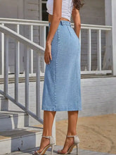 Light blue button-front denim skirt with a high waist, straight cut, and slightly stretchy fabric