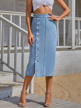 Light-wash slightly stretchy button-front denim skirt with midi length and side slit for stylish comfort