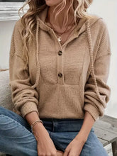 Beige button-front drawstring hoodie in slightly stretchy material with ribbed knit design, machine wash cold safe