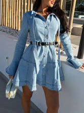 Light blue denim dress with button-front design and long flounce sleeves showcasing a flounce sleeve denim style