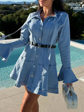 Light blue denim dress with button front, flounce sleeves, and black belt showcasing flounce sleeve denim style