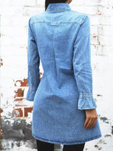 A light blue long sleeve denim dress with collar ruffled cuffs and straight hem in button front denim dress style