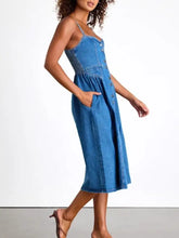Button-front midi denim dress with thin straps side pockets and button detailing in blue denim fabric