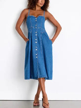 A blue midi denim dress with thin straps and front button closure made from durable denim fabric