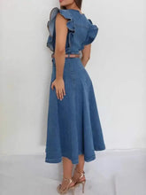 Blue denim midi dress with button front ruffle shoulder sleeves and matching belt in a denim midi style