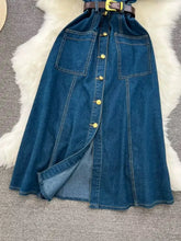 Deep blue denim dress with button front, short sleeves, two front pockets, and a matching belt with gold buckle