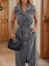 Button front sleeveless denim dress in faded gray wash with button closures and front pockets